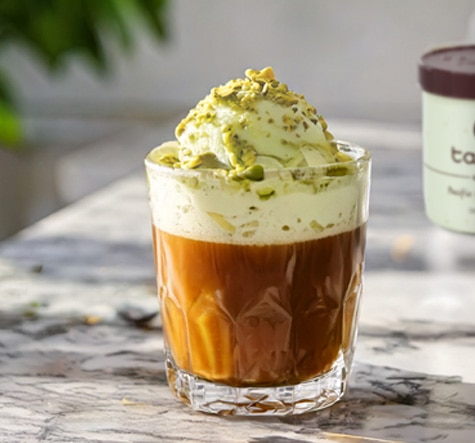 Glass of pistachio affogato with a pint of Talenti Pacific Coast Pistachio Gelato