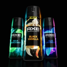 A man applying fragrance to his wrist teaser.