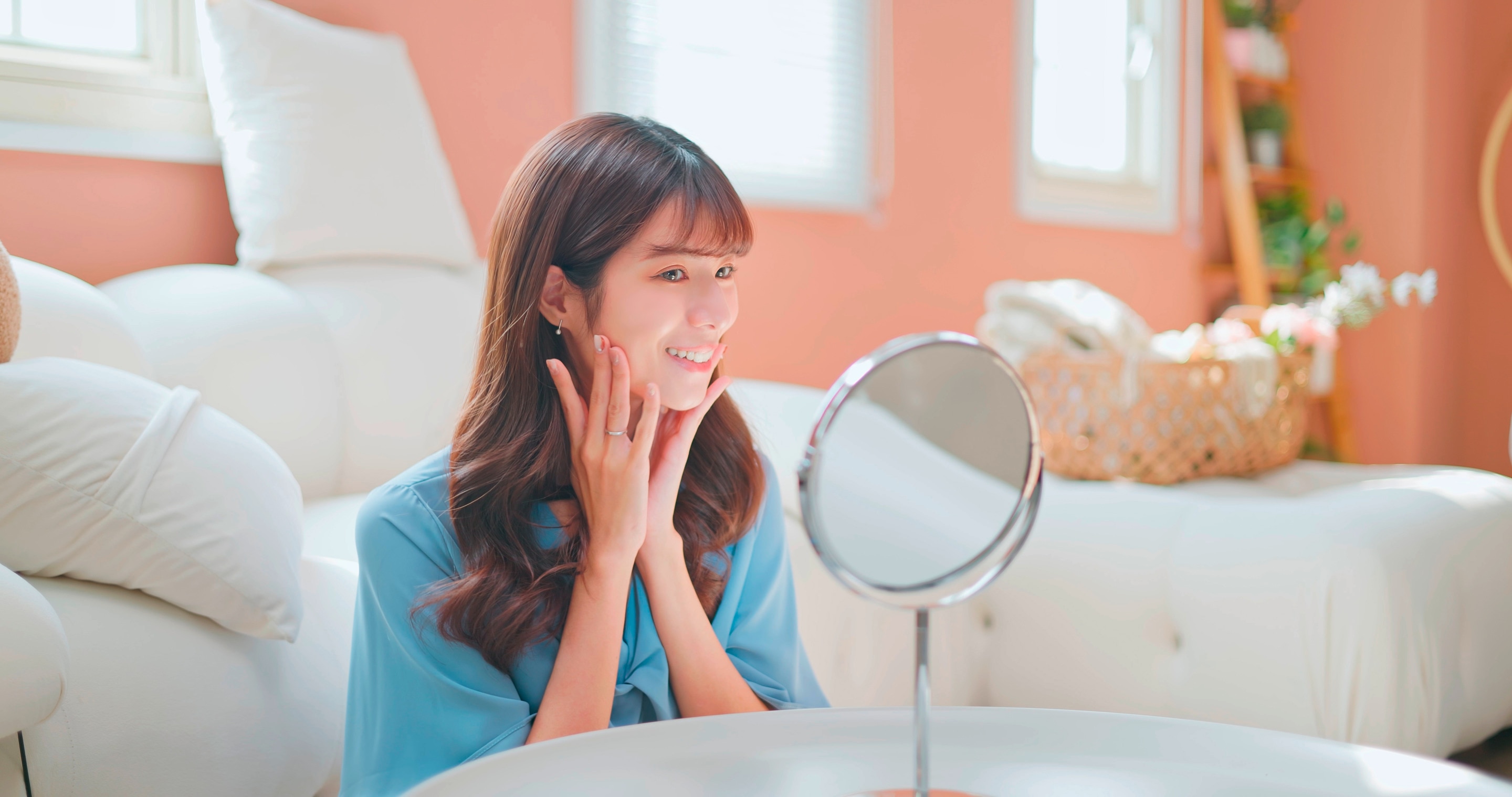 Woman checking her appearance in the mirror.