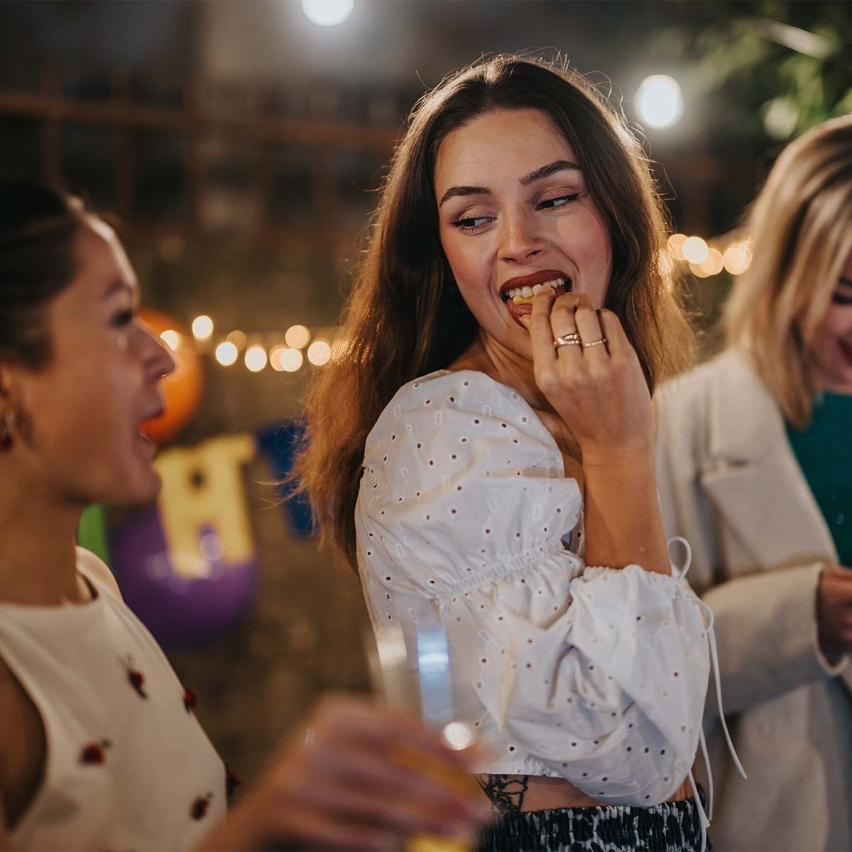 Close-up shot of two friends having fun at an ice cream social