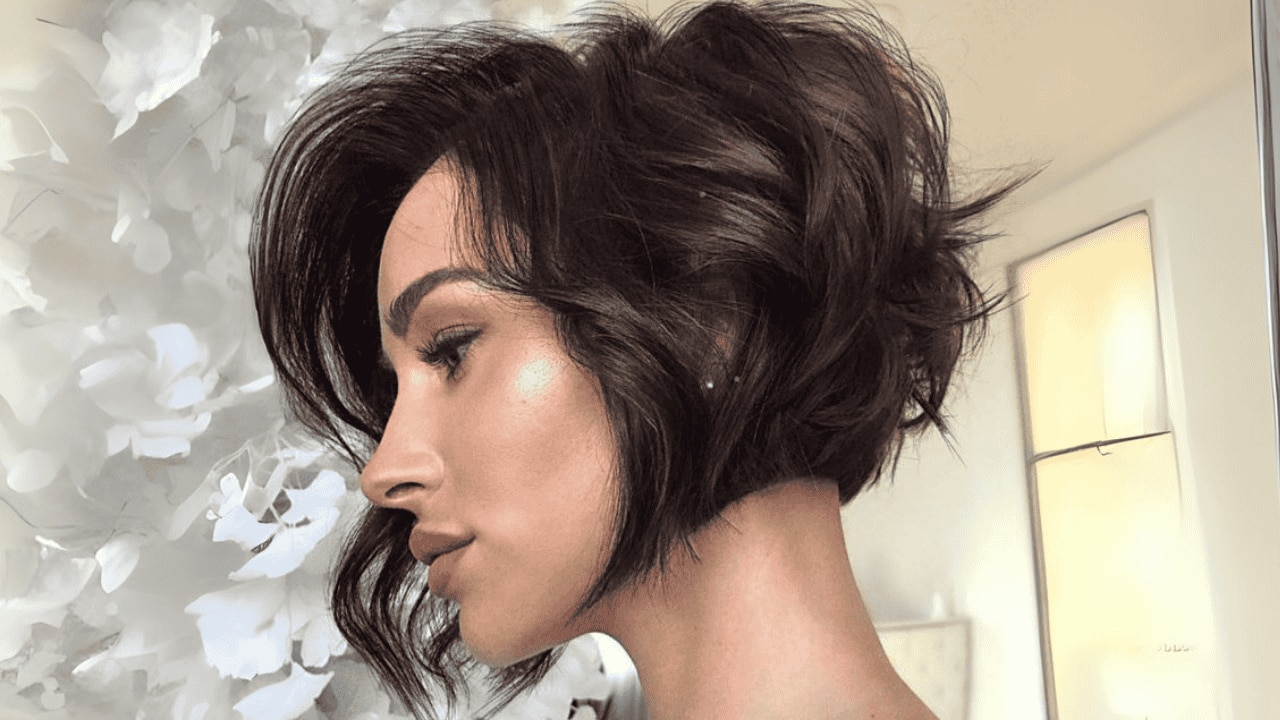 Curly pixie cut with a fringe