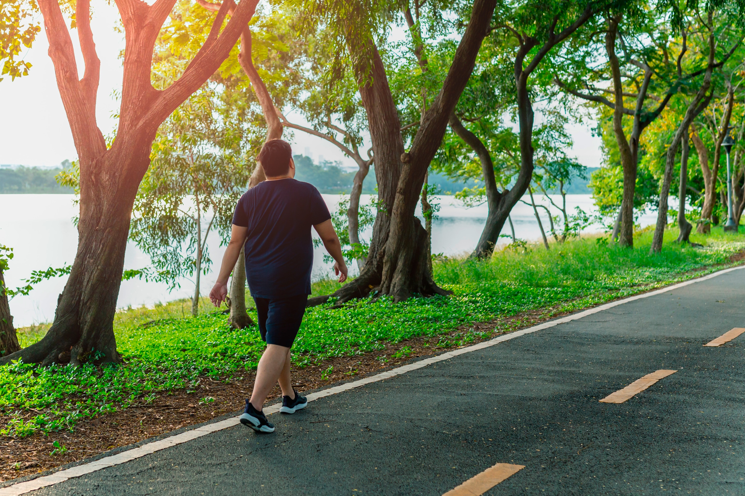 Man taking a walk outdoors.