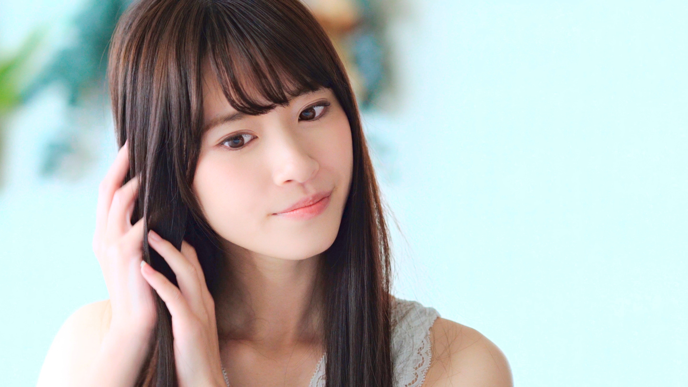 Woman combing her hair with her fingers.