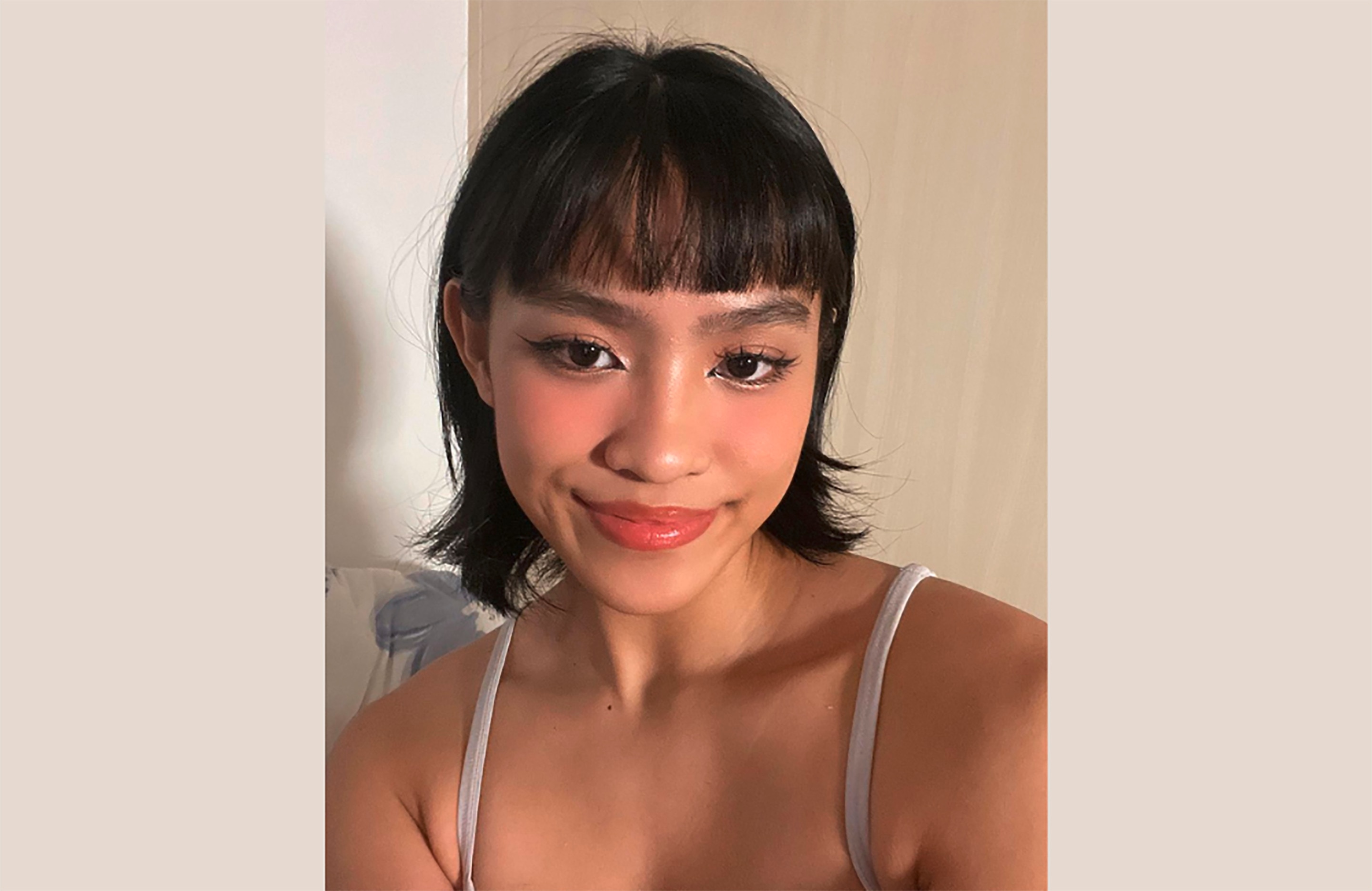 A selfie of woman with bob hair in igari makeup.