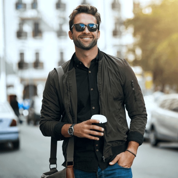 A young man in the city feeling confident wearing antiperspirant deodorant for men.