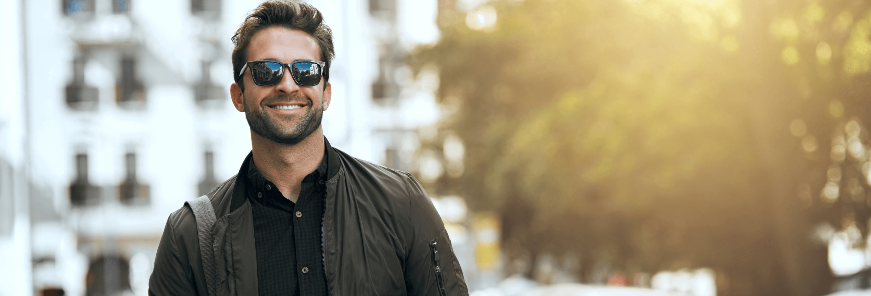 A young man in the city feeling confident wearing antiperspirant deodorant for men.