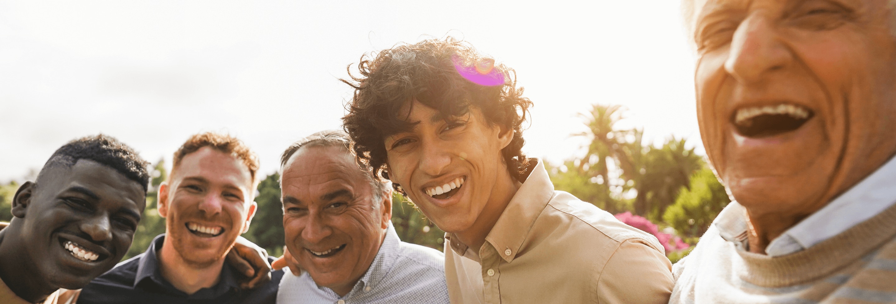 Group of multi-generational men looking confident and happy because they’re wearing the best deodorant for their needs.