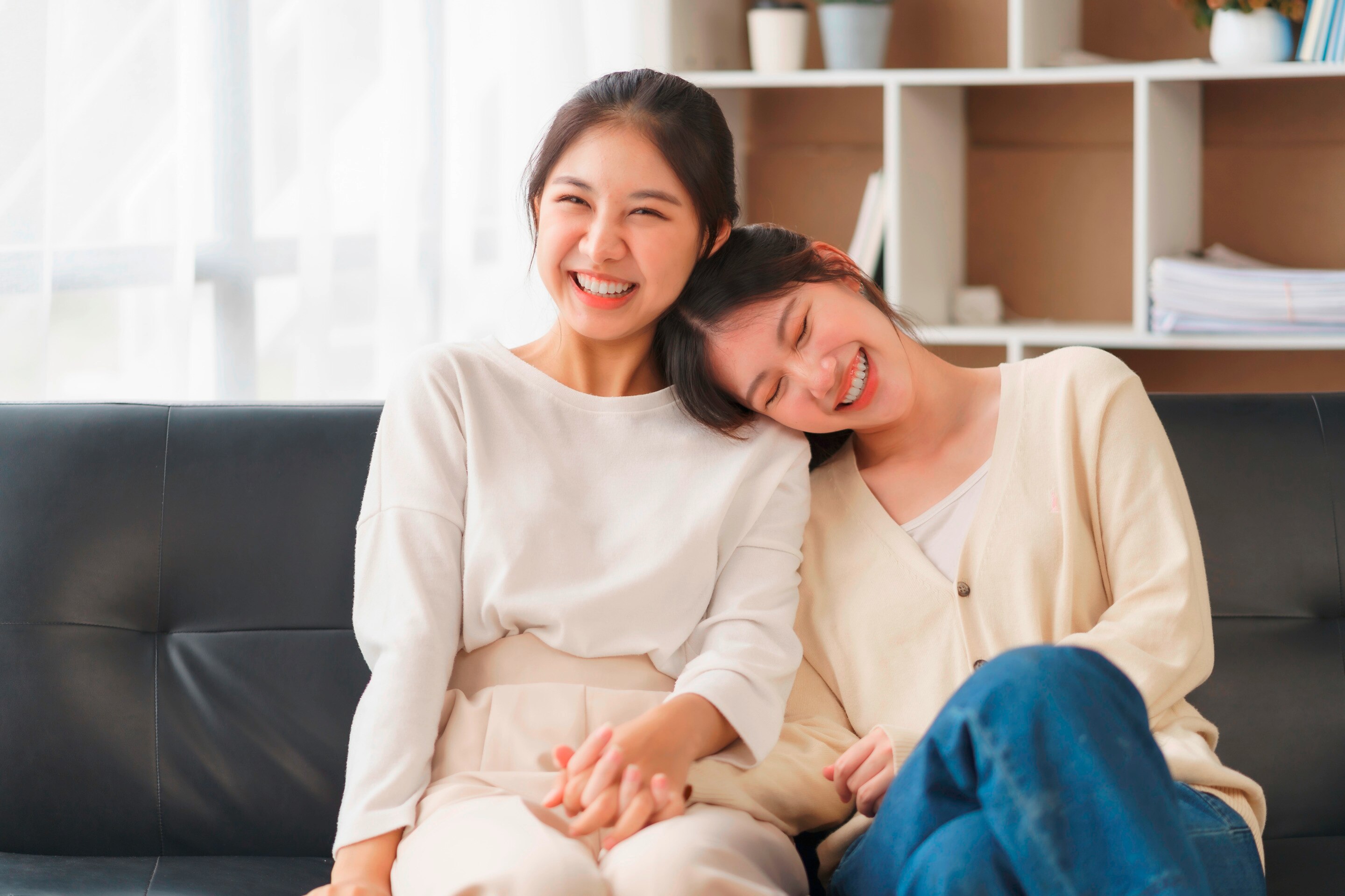 Lesbian couple holding hands.