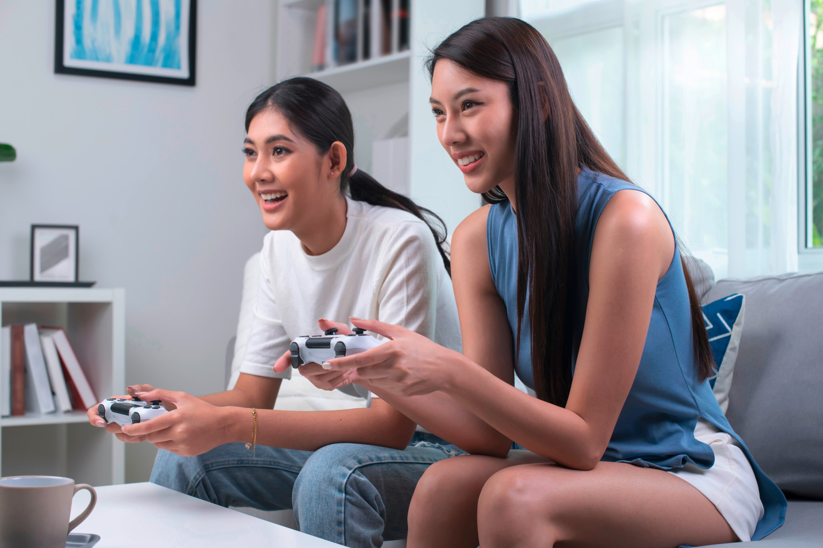 Lesbian couple playing video games.