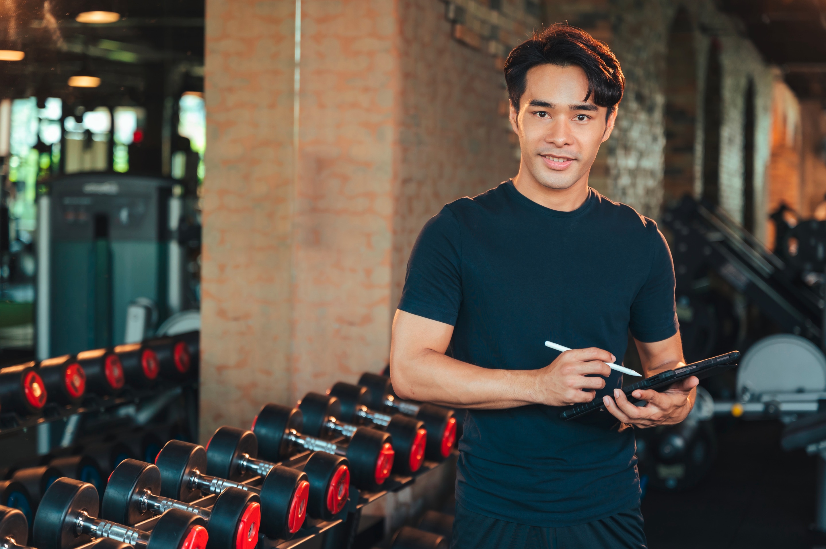 Gym coach taking down notes.