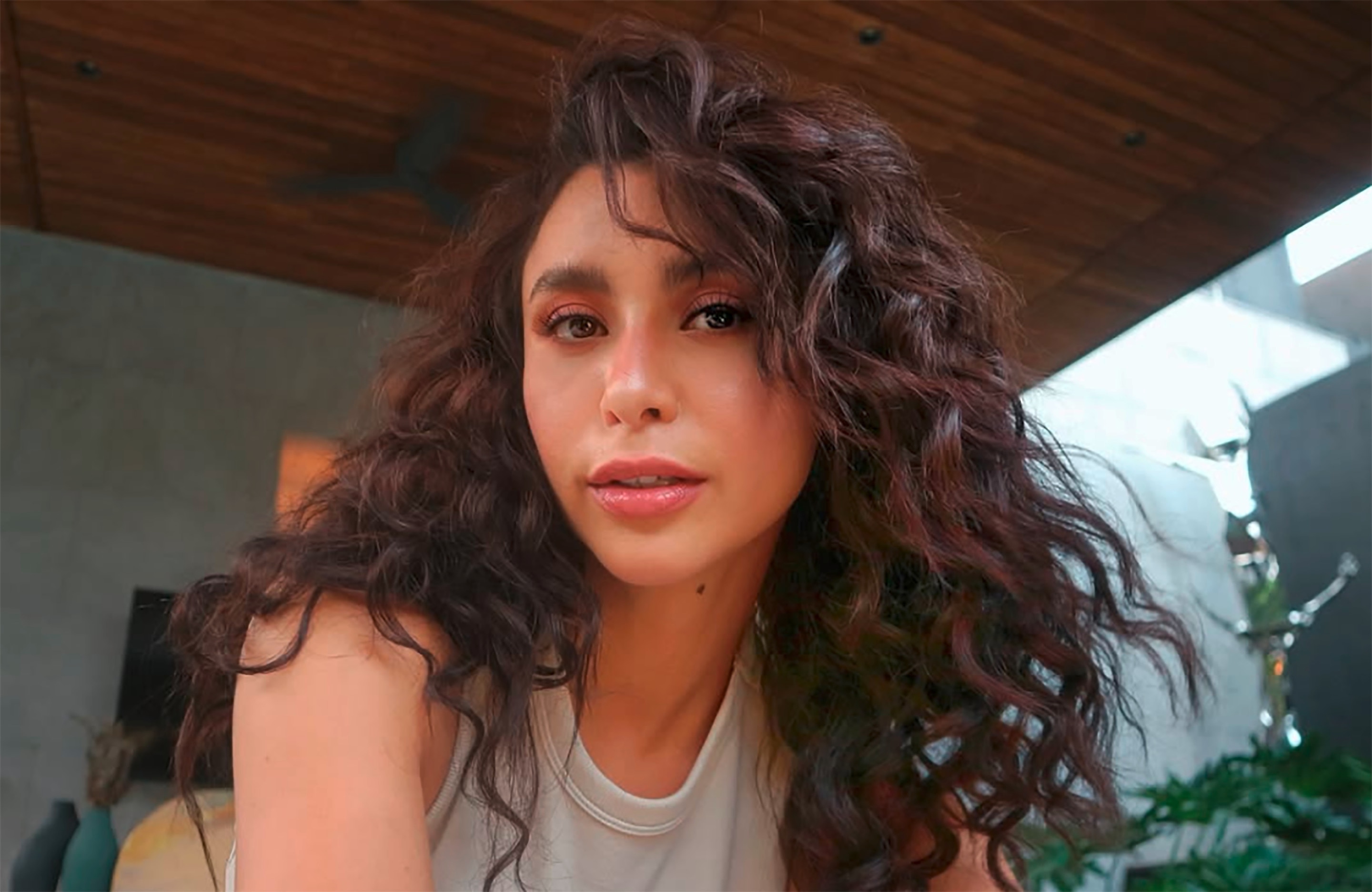 A Filipina actress wearing her natural curly hair.