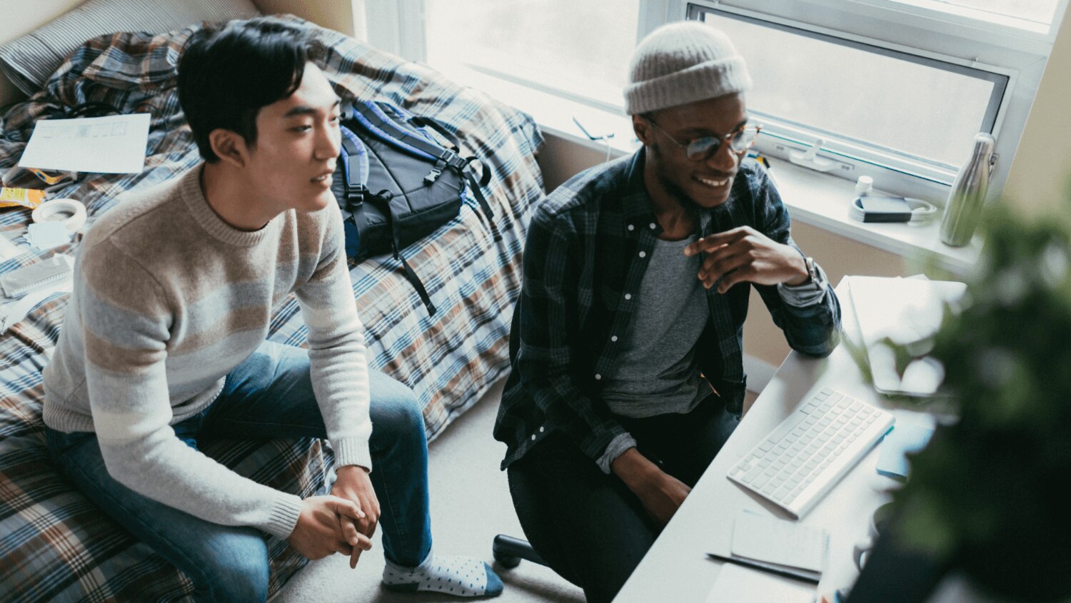 Young tattooed male towel drying his hair after washing it with sodium laureth sulfate shampoo. 