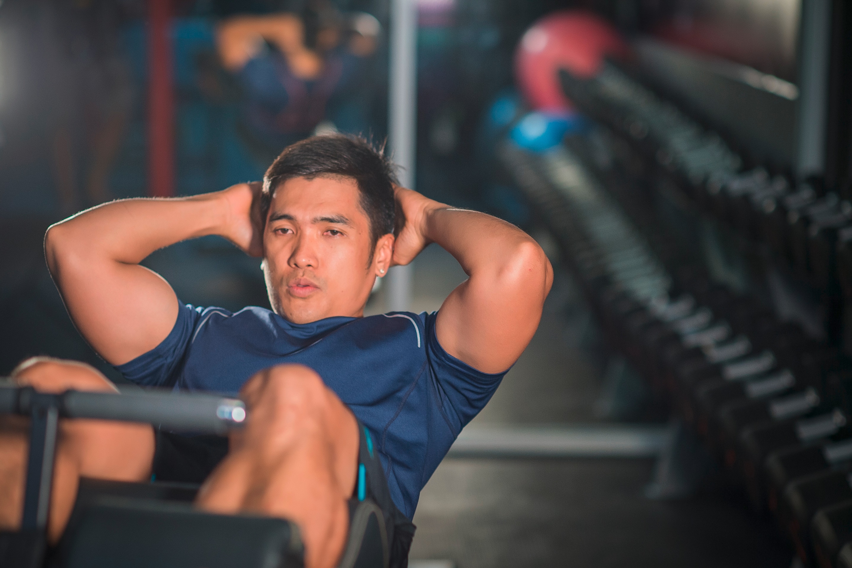 Man doing sit-ups on decline bench.