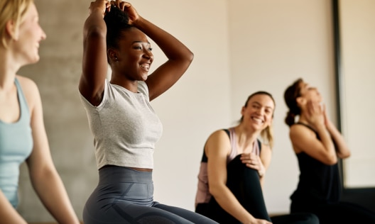 Group of young women chatting after an exercise class with no sign of excessive sweating