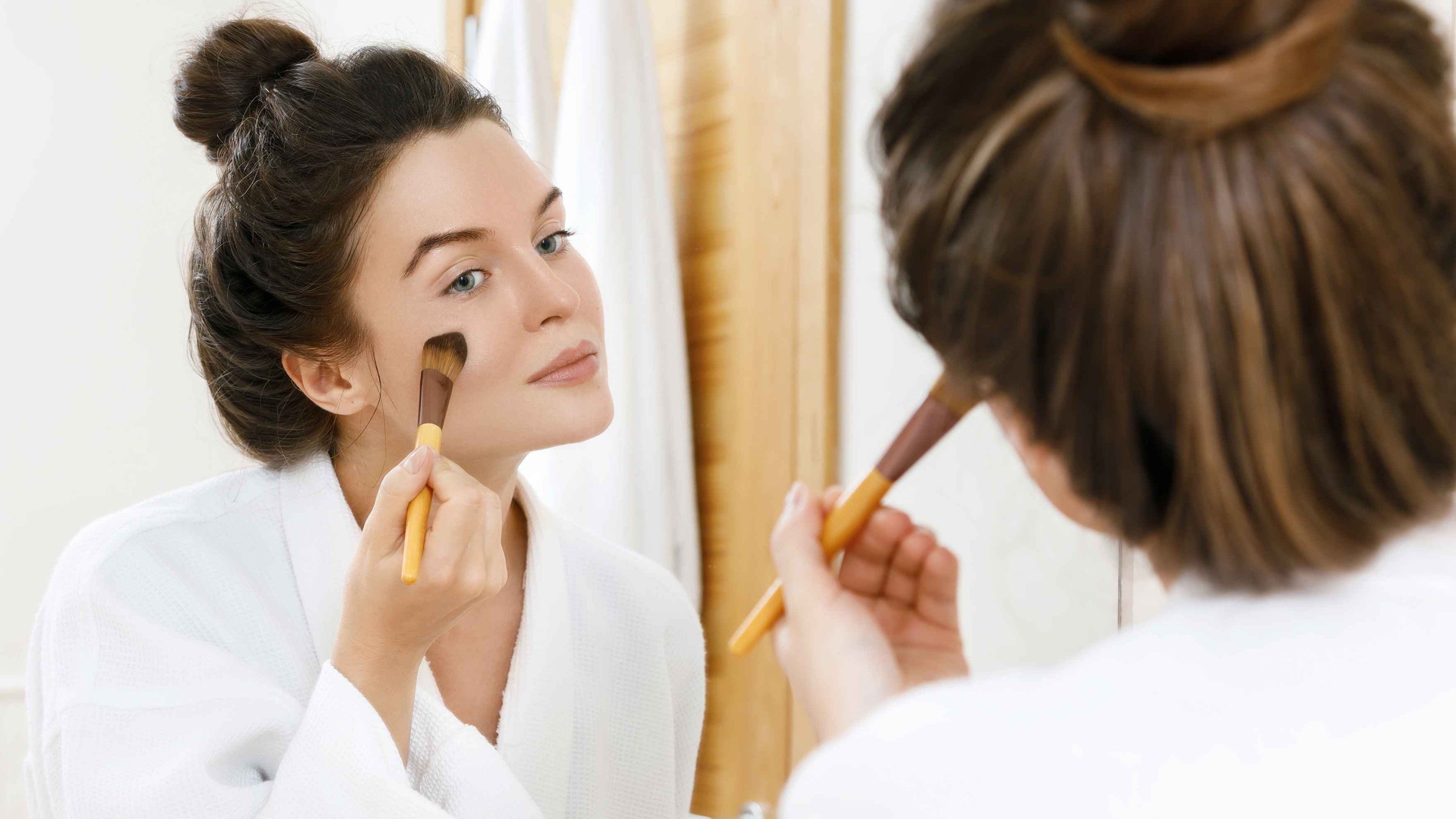 Apply foundation or a skin tint for an even base Image
