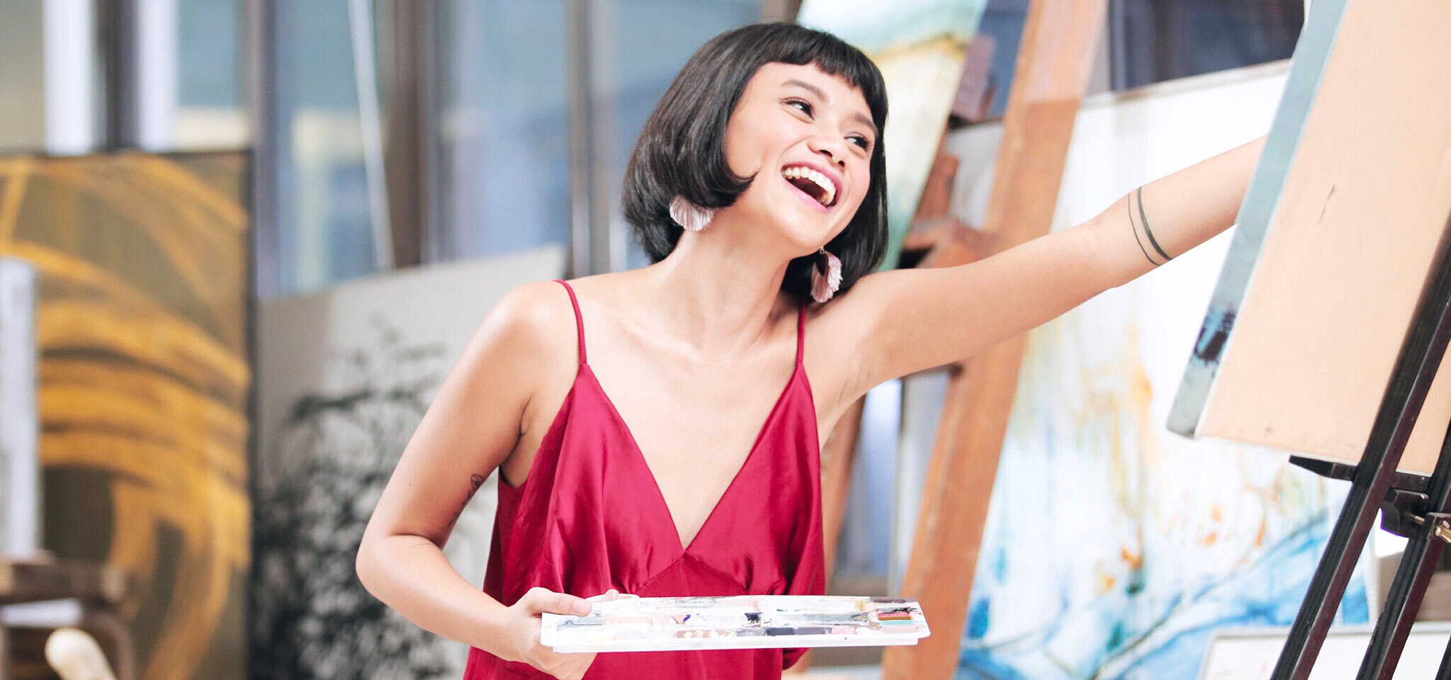 A woman in red blouse smiling