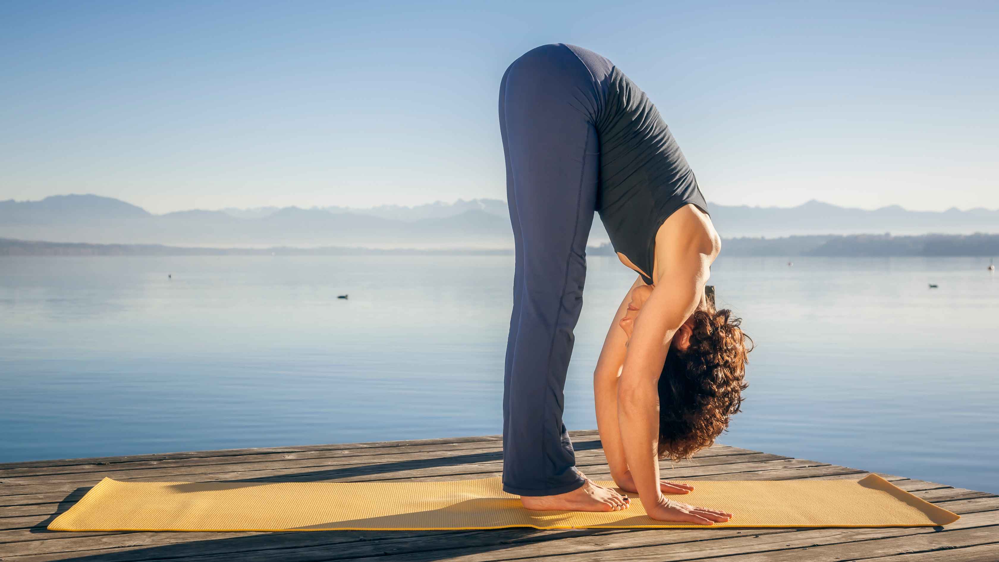 2. Uttanasana (Standing Forward Bend)