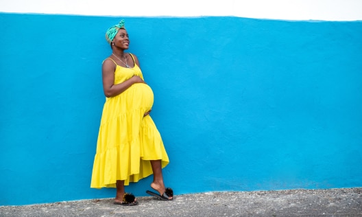 Beautiful African American pregnant woman wearing pregnancy-safe deodorant