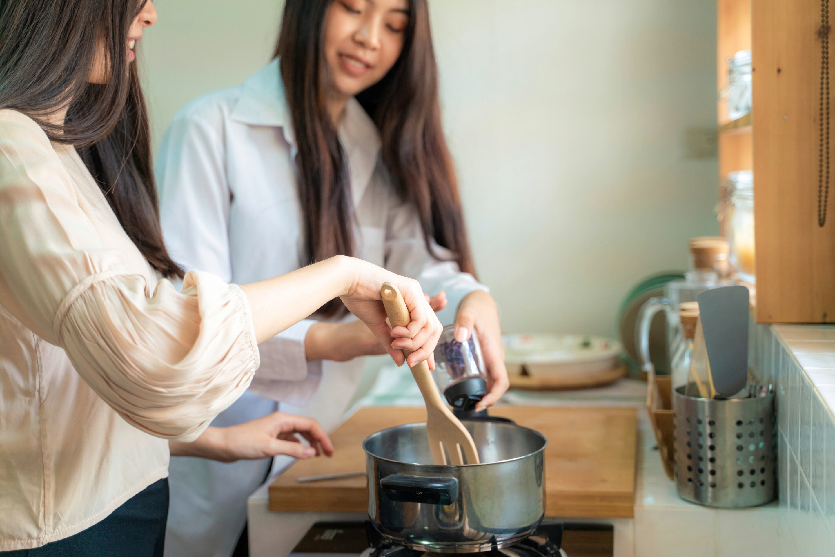 Friends cooking in the kitchen.