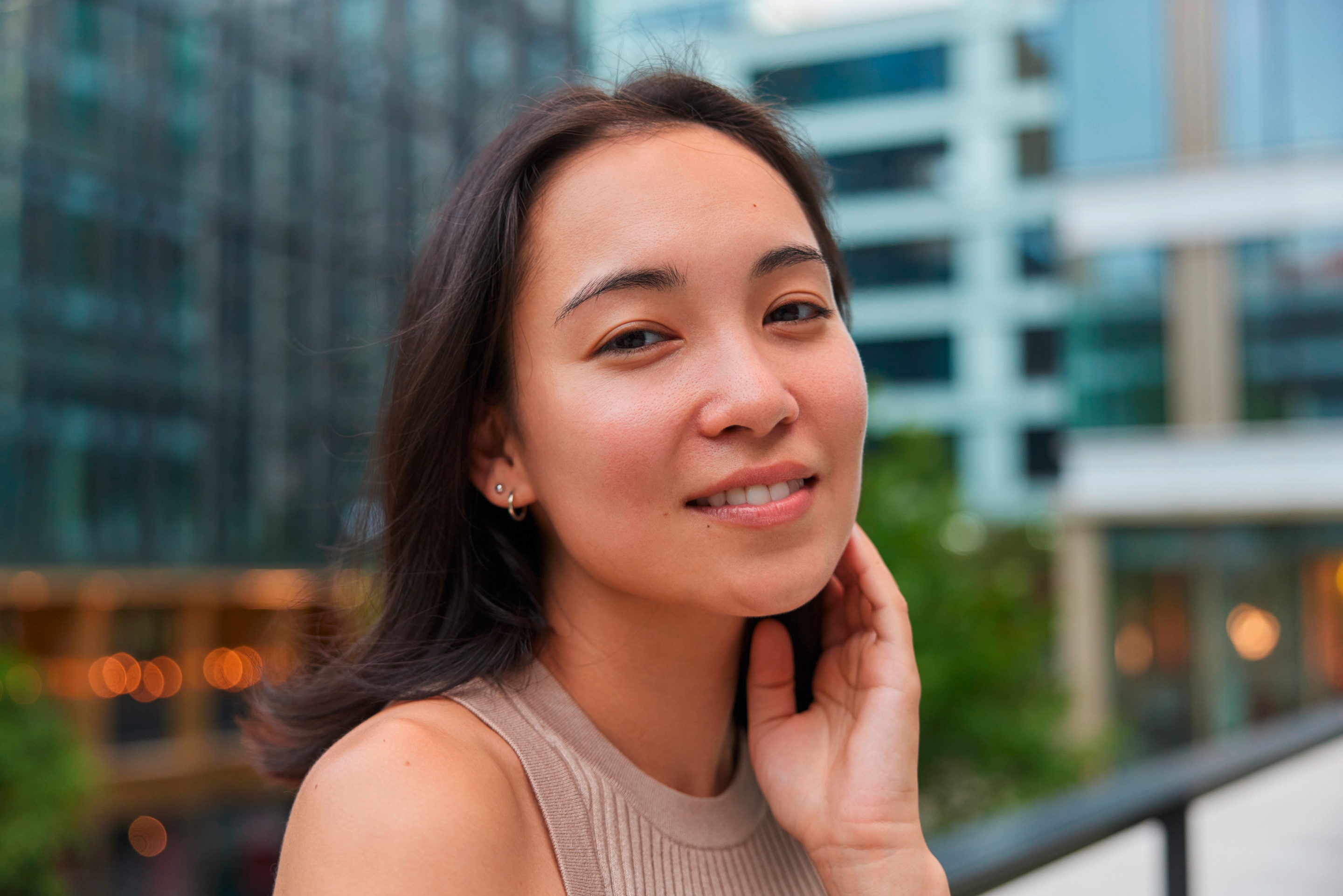  Young woman touching her hair. 