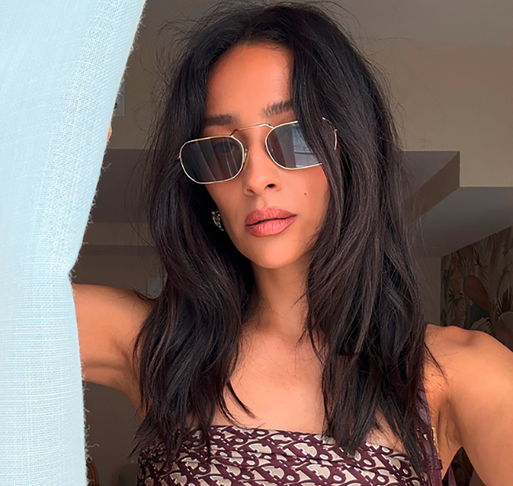 A woman wearing sunglasses.