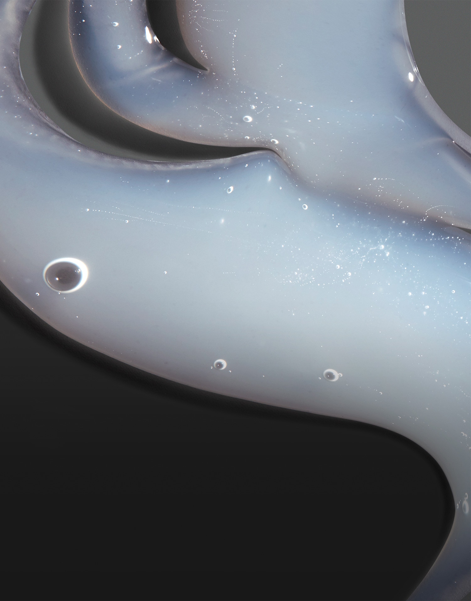 White shampoo product texture against a black background