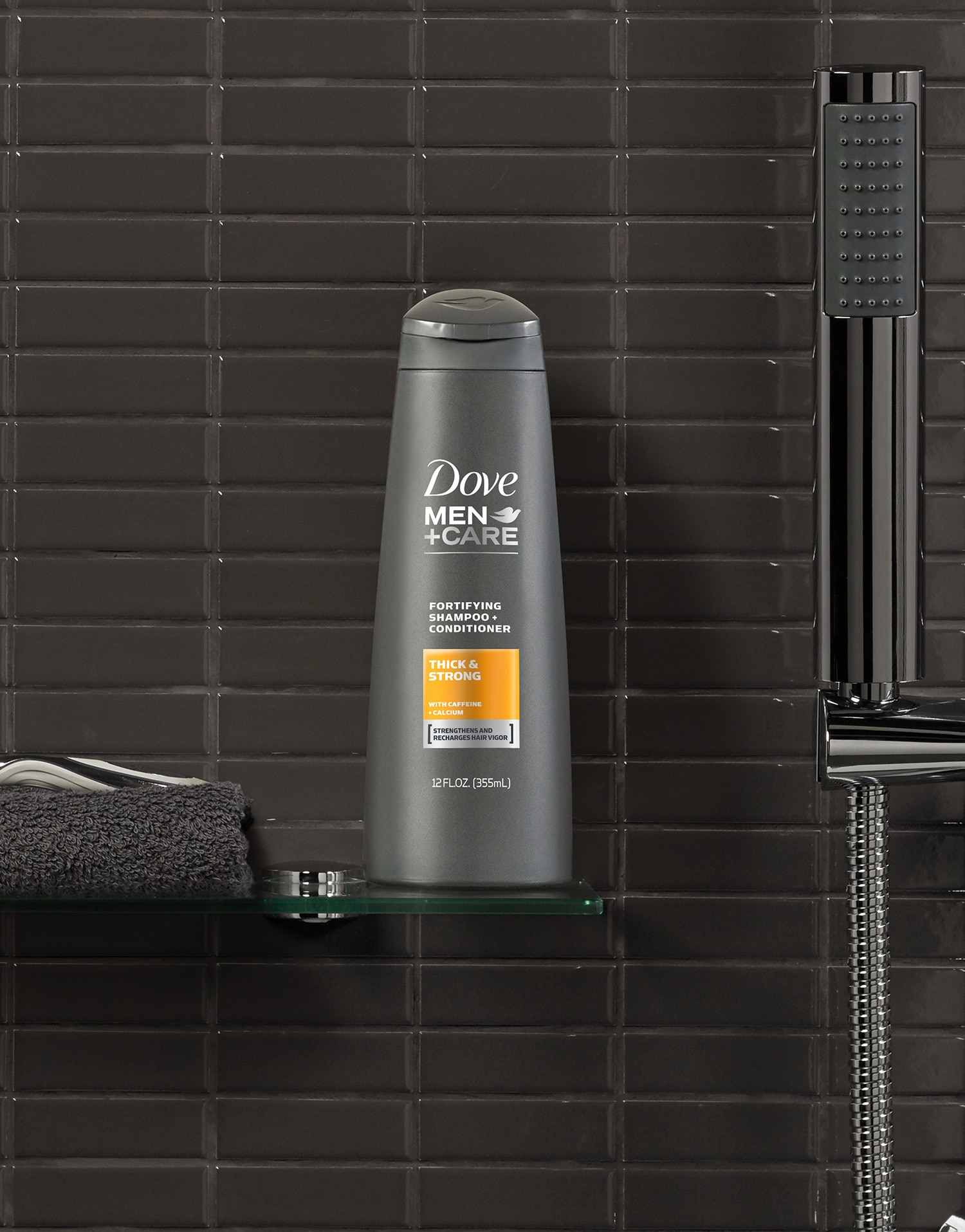 Dove Men+Care shampoo product placed against a dark gray bathroom background