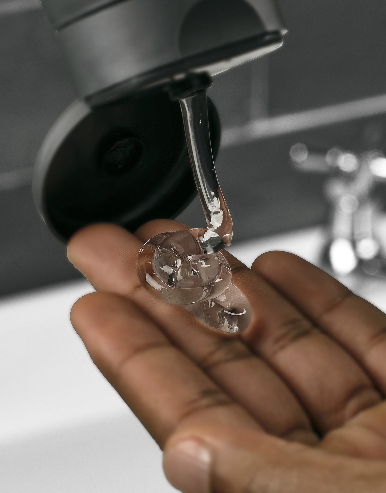 Clear product being squeezed onto hand