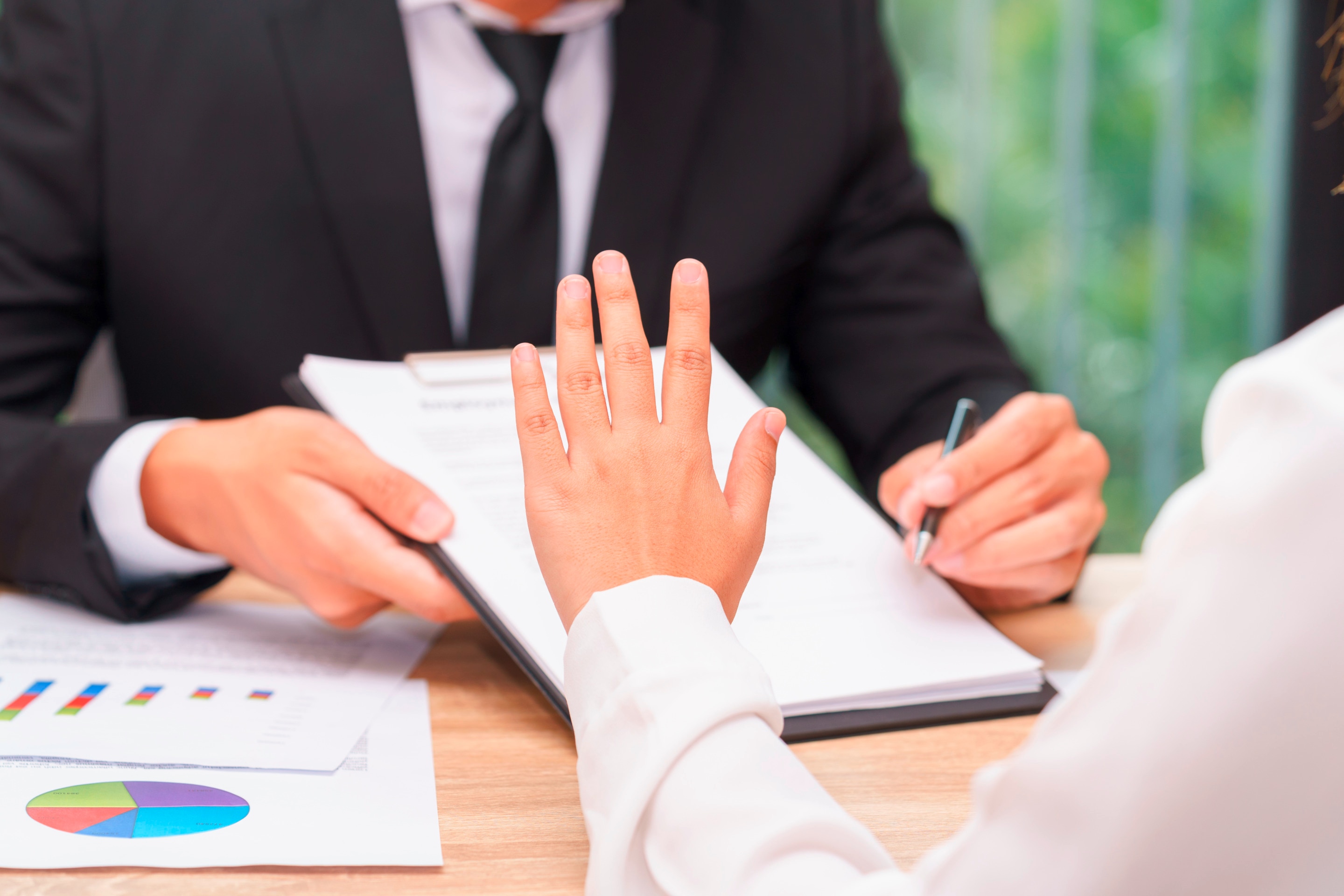 Closeup of a woman making a no gesture at work.