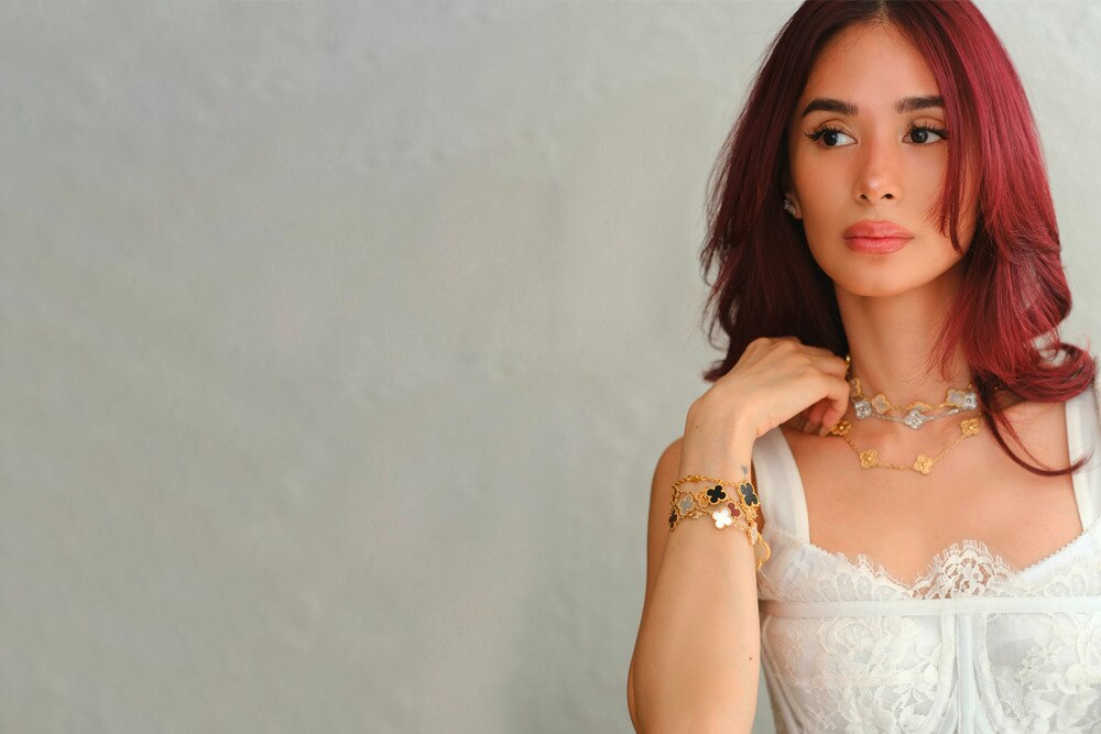 Heart Evangelista with burgundy hair, wearing white shirt.