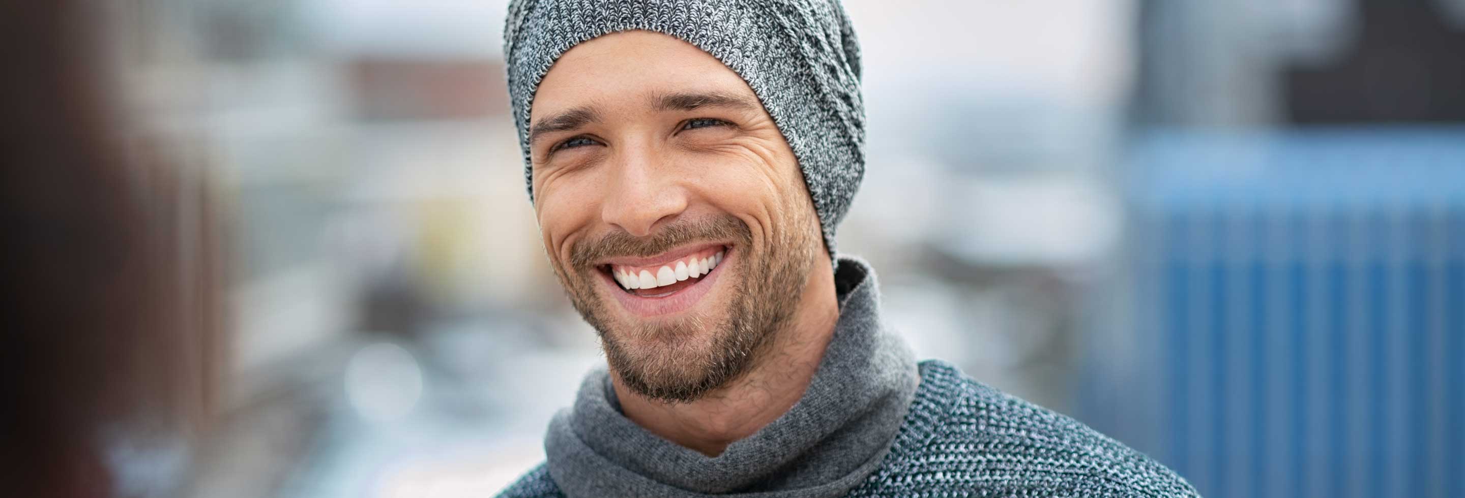 Young man outdoors in Winter gear with no sign of dry Winter skin