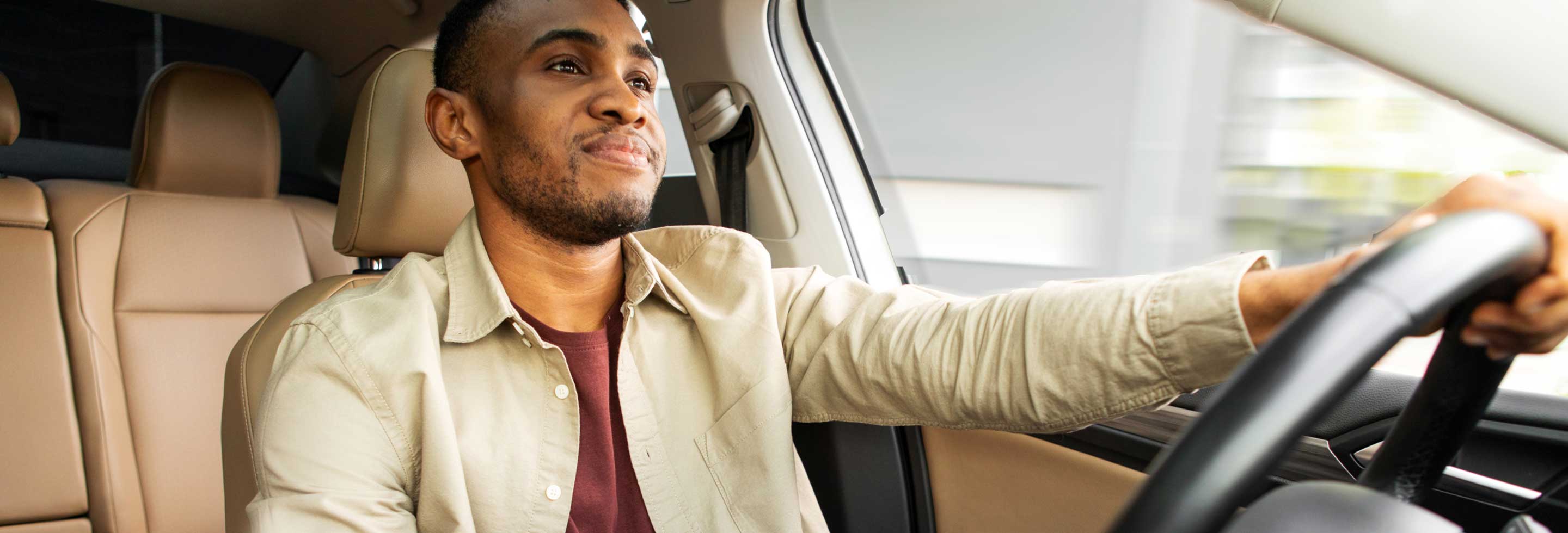 Young man driving and wearing aluminum-free deodorant