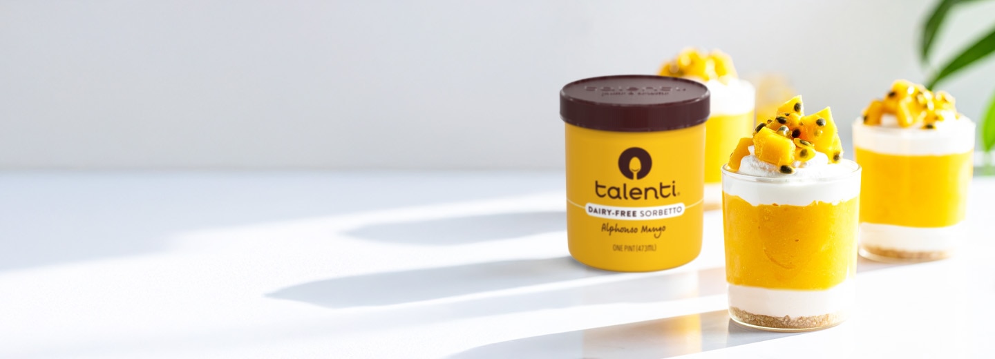 Alphonso Mango Cheesecake Cups in tumbler glasses made with Talenti Alphonso Mango Sorbetto