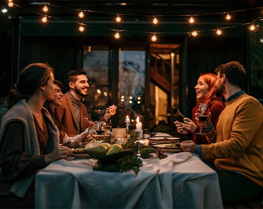 Preview image of group of friends enjoying a festive holiday table of desserts