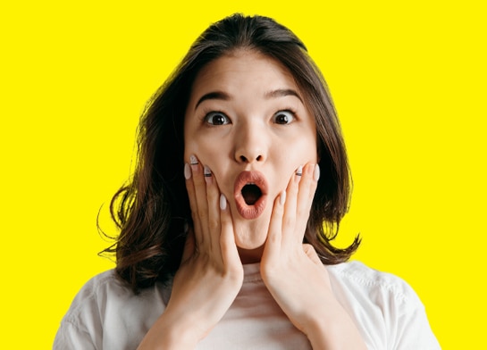 Young woman surprised by how much she enjoyed a Jolly Rancher Sour Ice Pop