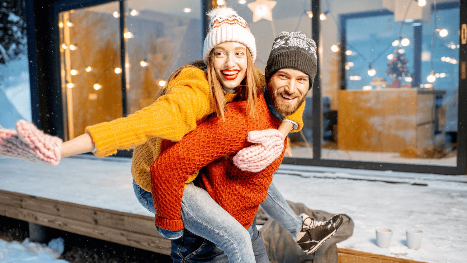 Young couple enjoying a day out in the snow getting ready for a winter workout
