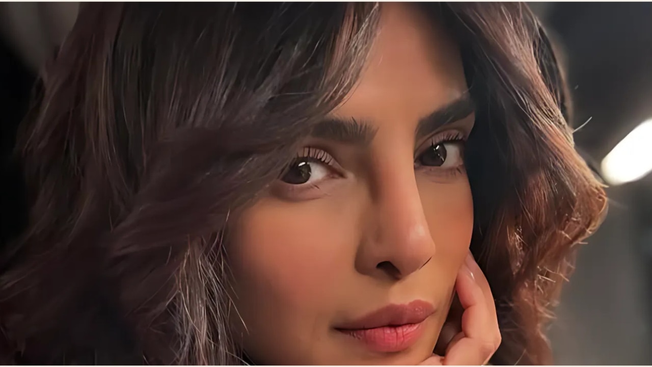 2. Feather Cut with Curtain Bangs