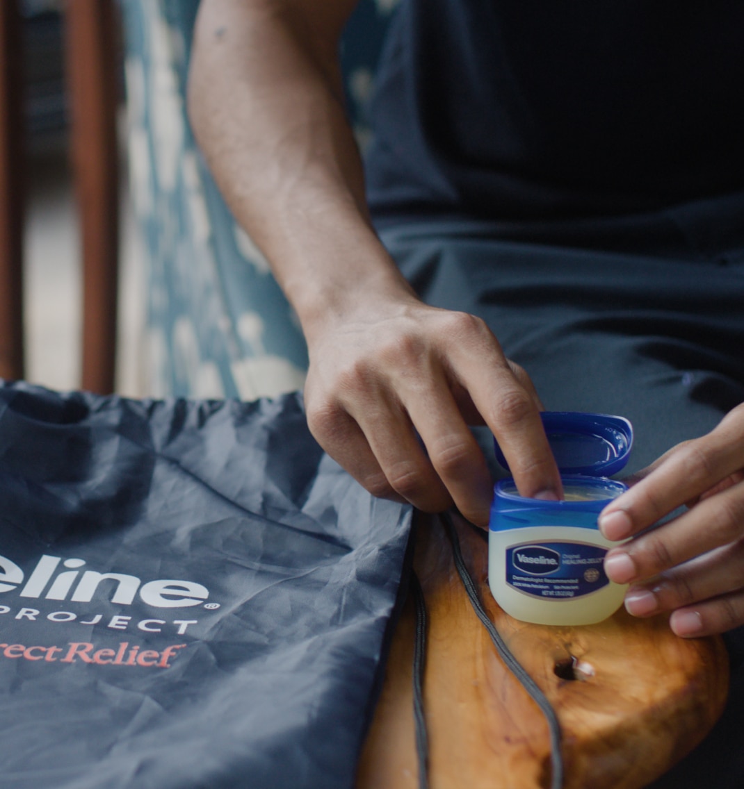 Open container of Vaseline Healing Jelly being used