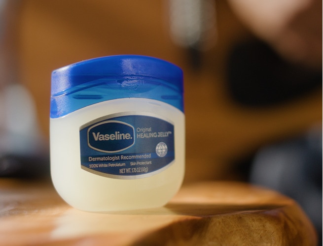 Vaseline Healing Jelly on a wooden tabletop