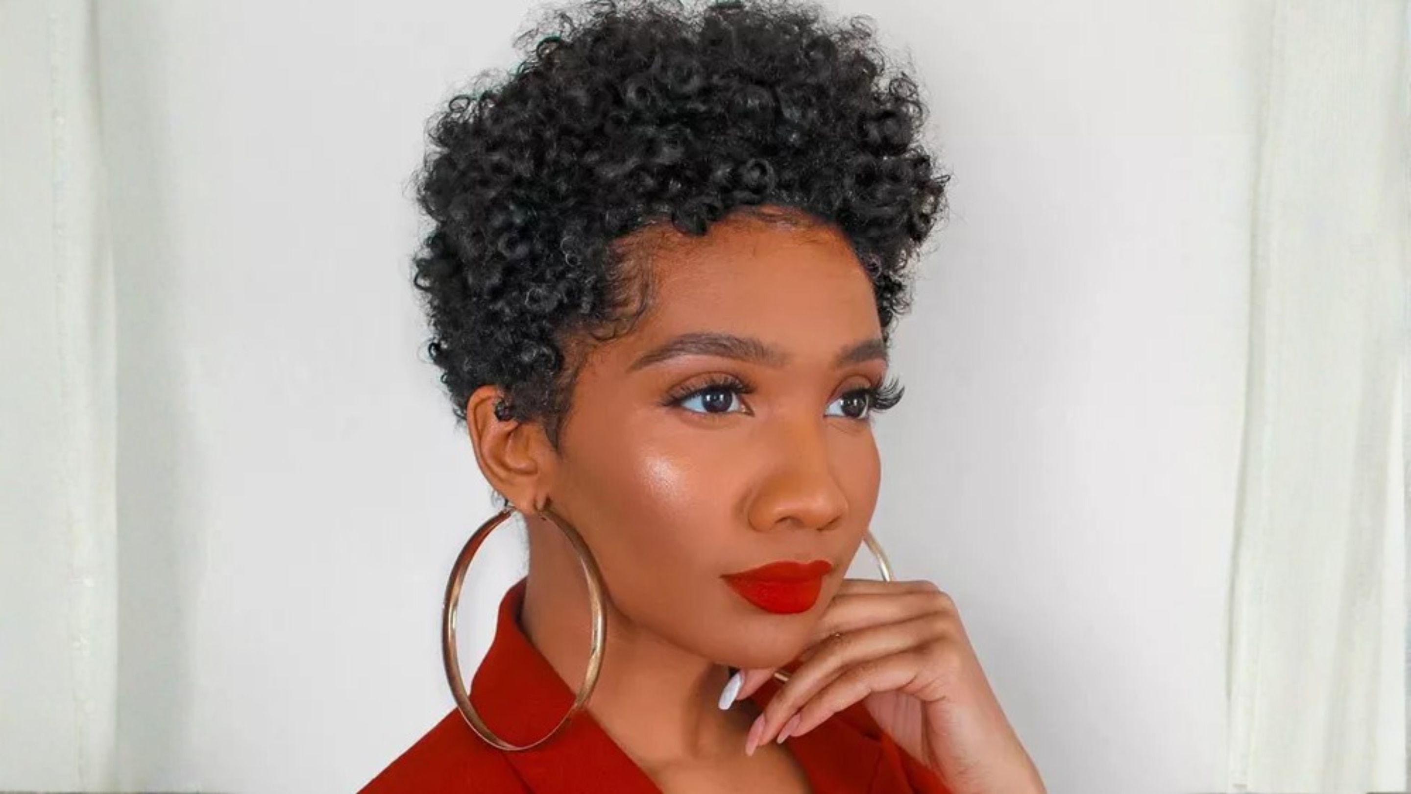 3. Short Haircut for Curly Hair Oval Face (Curly Tapered Cut):