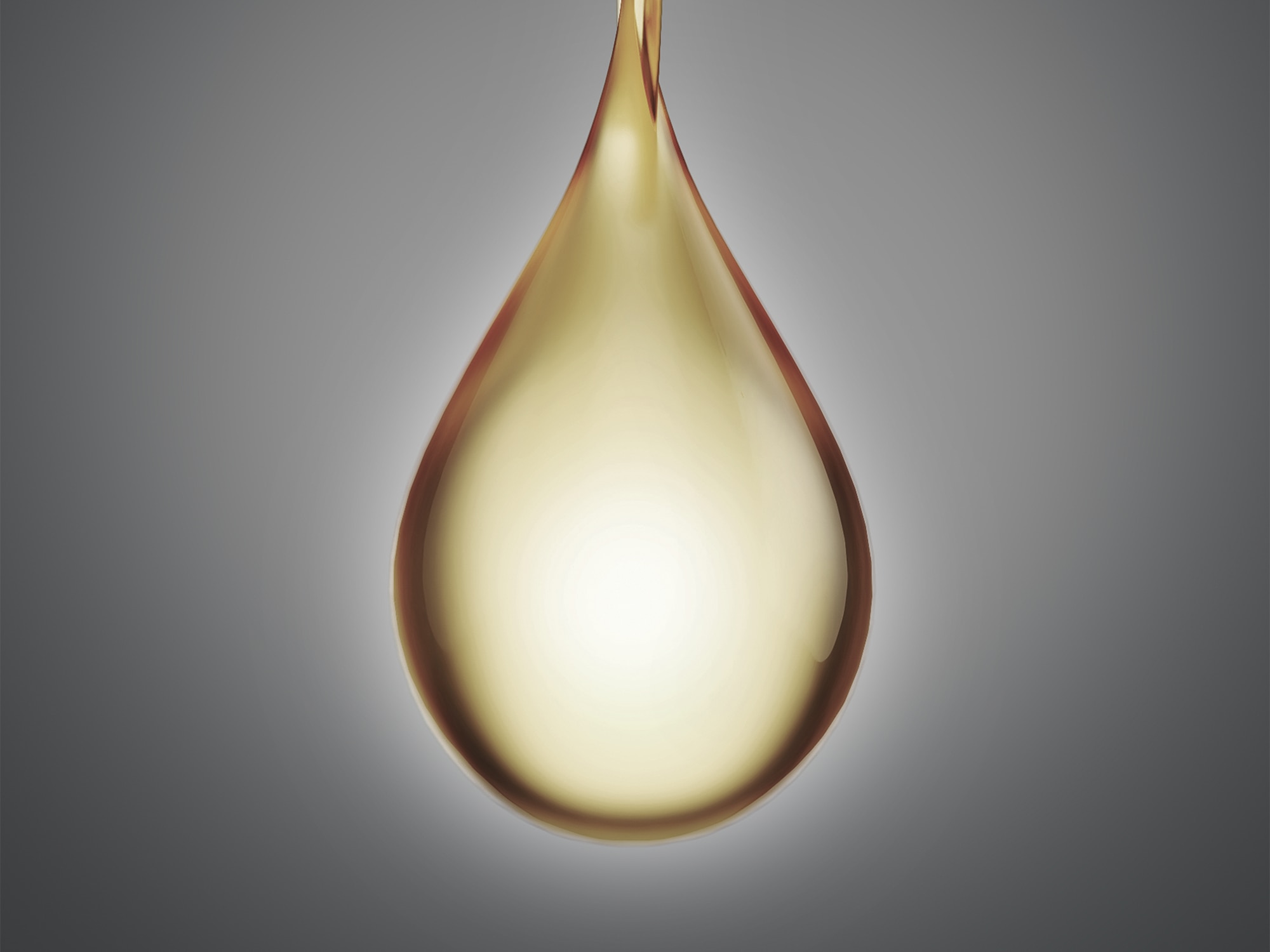 Illuminated droplet against a grey background 