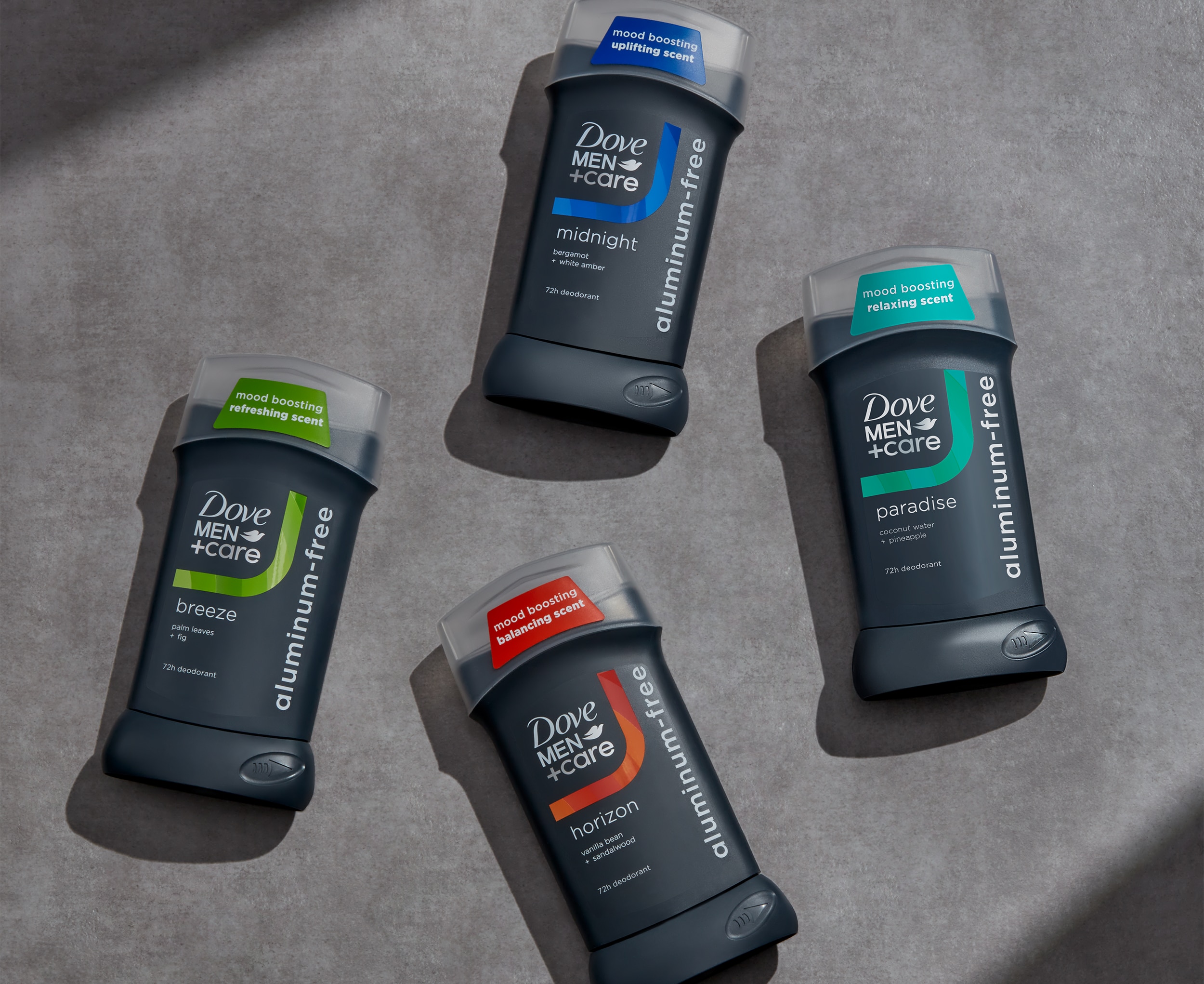 Mood boosting antiperspirant range layered against a grey background 