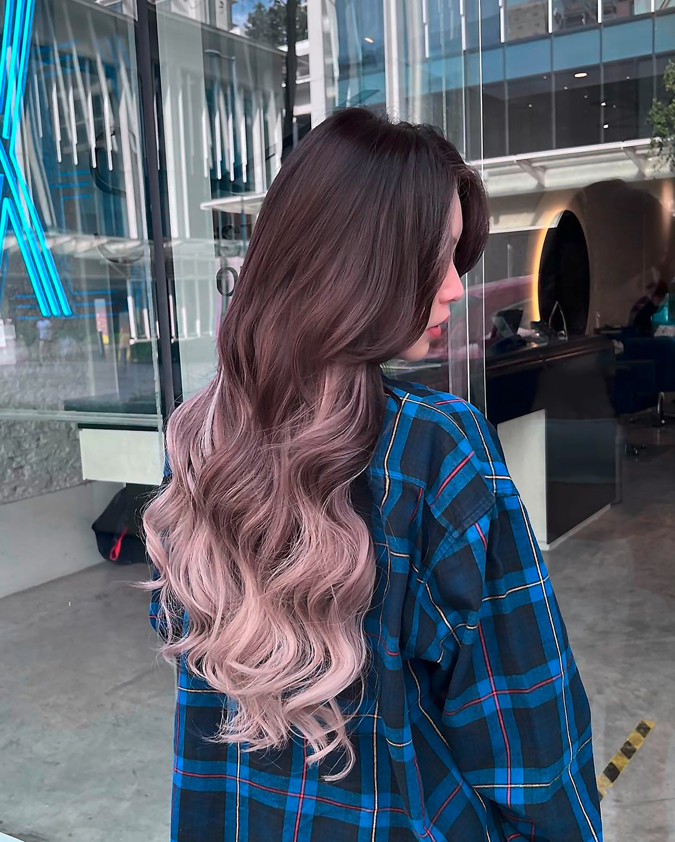 Woman with long, ombré lavender hair.