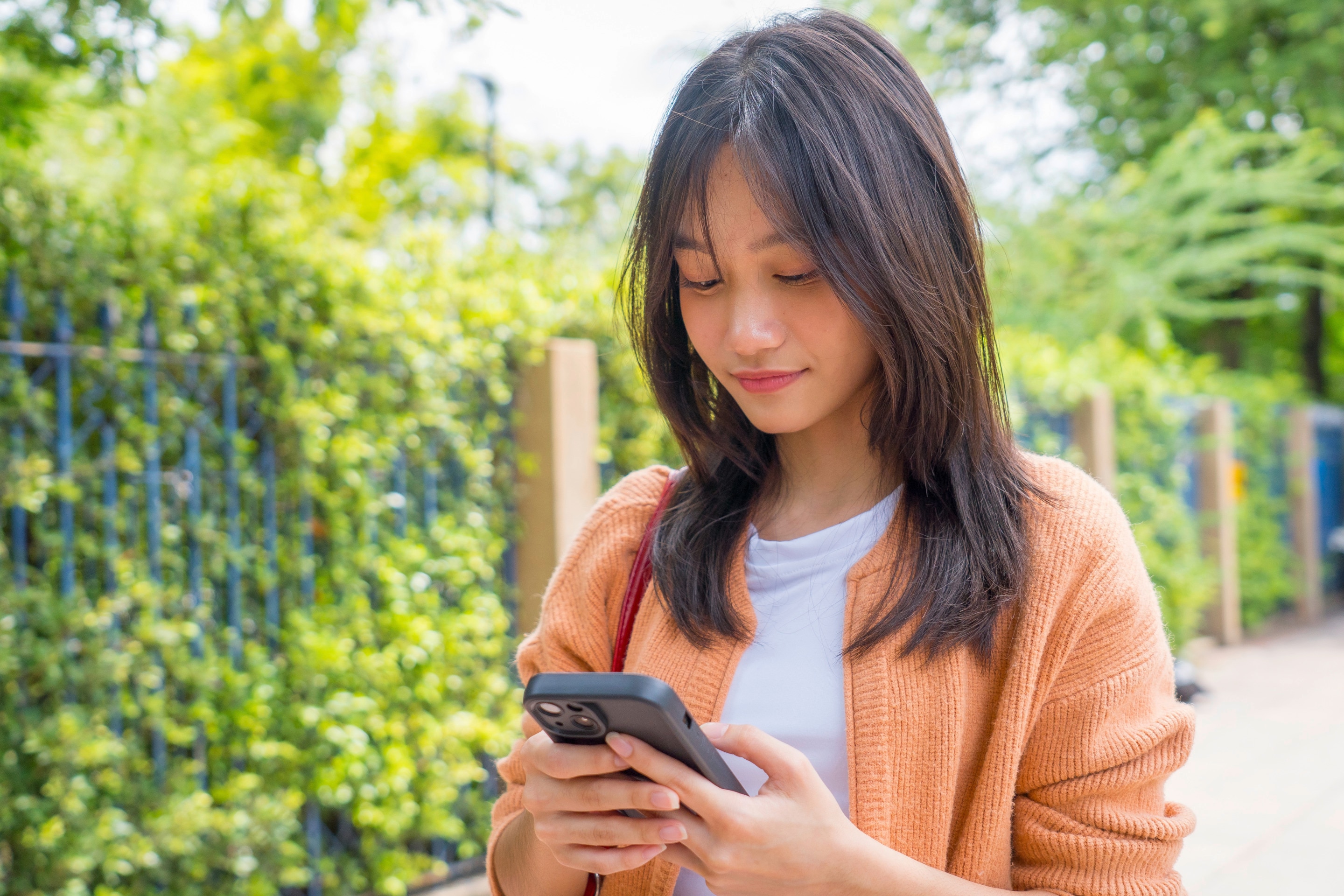 An Asian woman with layered bangs.