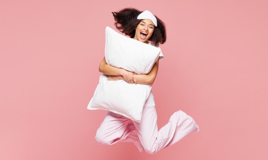 Happy African American woman waking up getting ready for her morning skincare routine