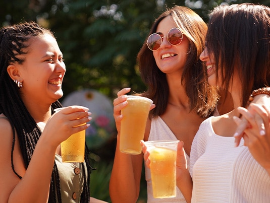 Group of friends enjoying a Good Humor Cider Mocktail Float