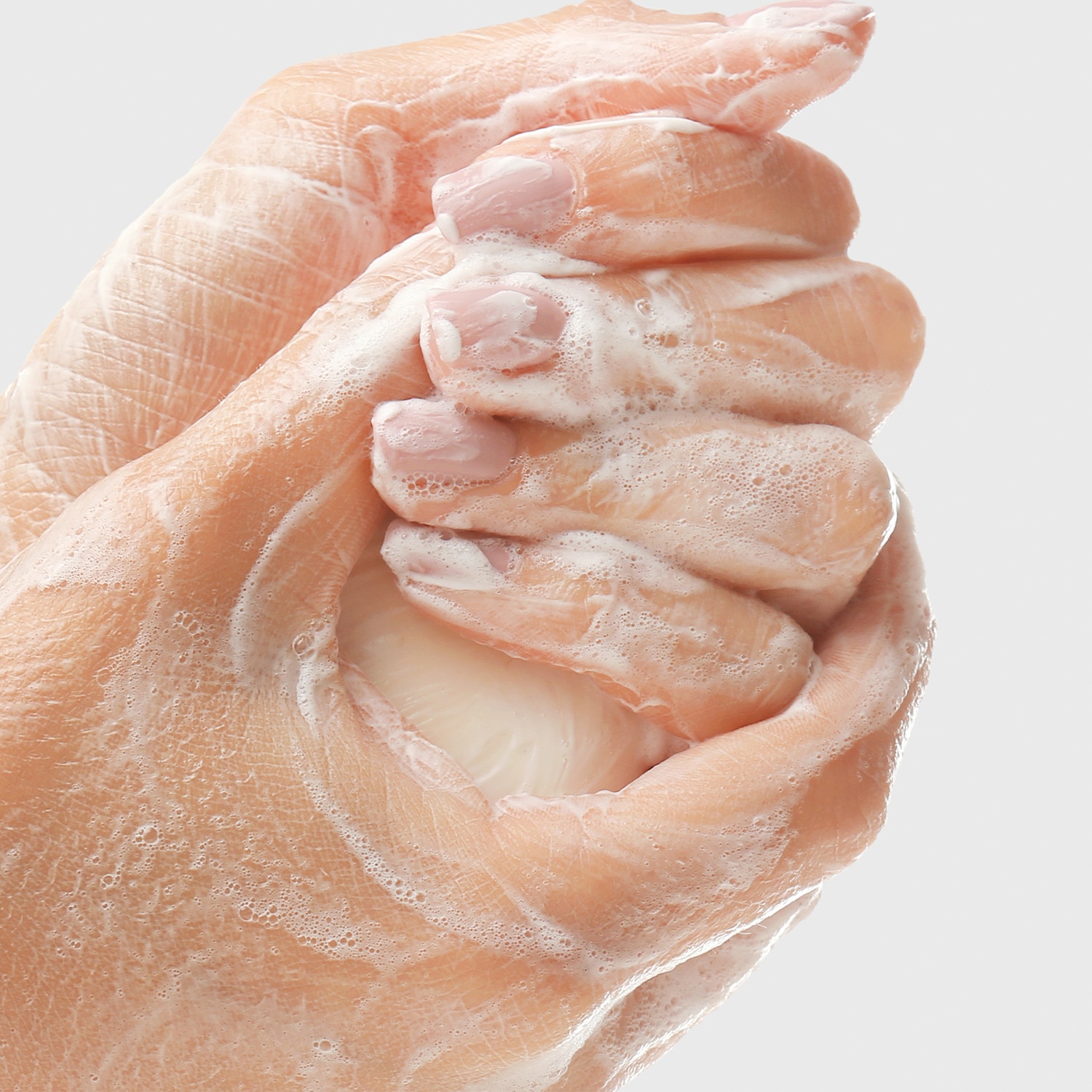 Woman looking off to the left had side, with face bathed in sunlight