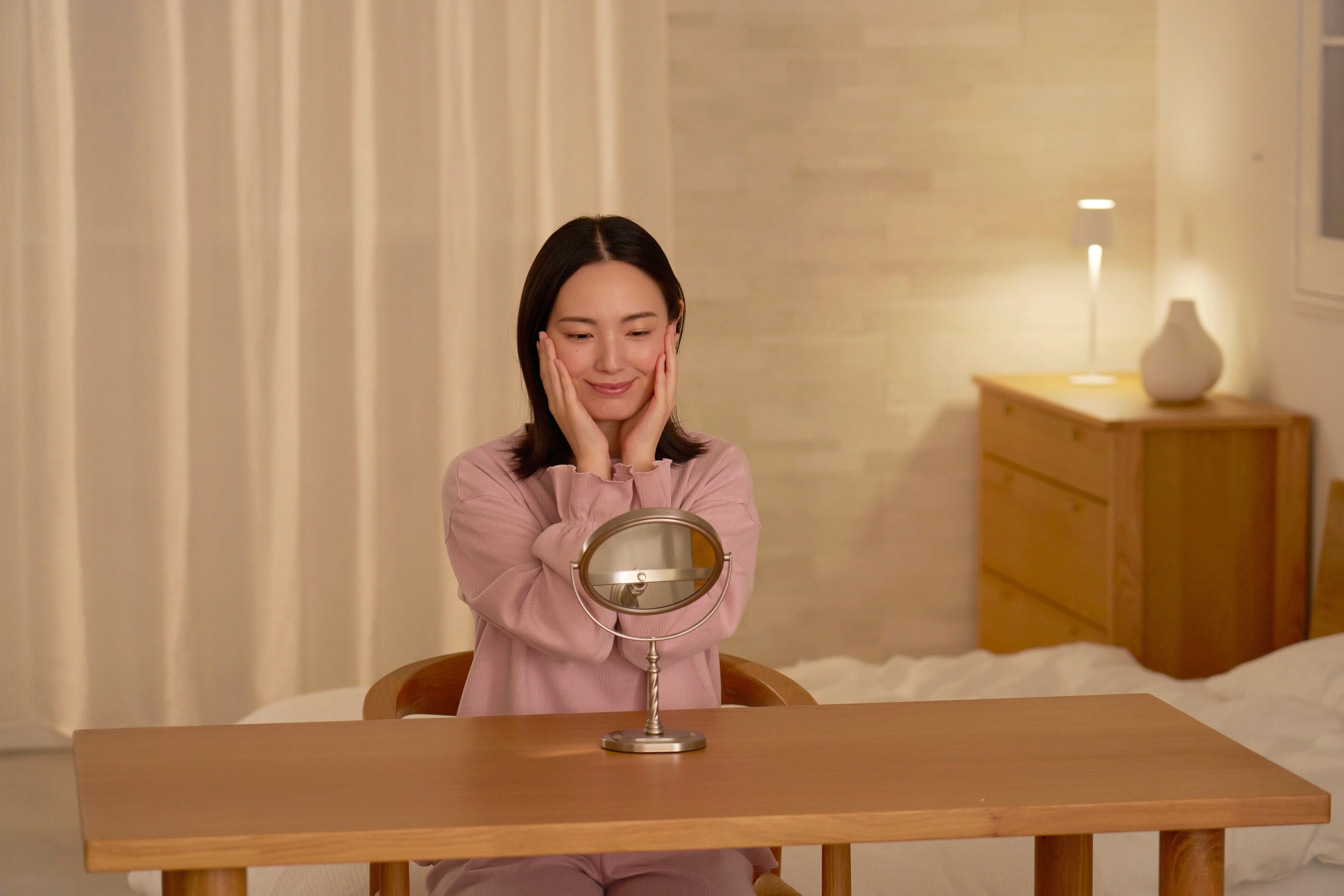 Woman checking her skin.