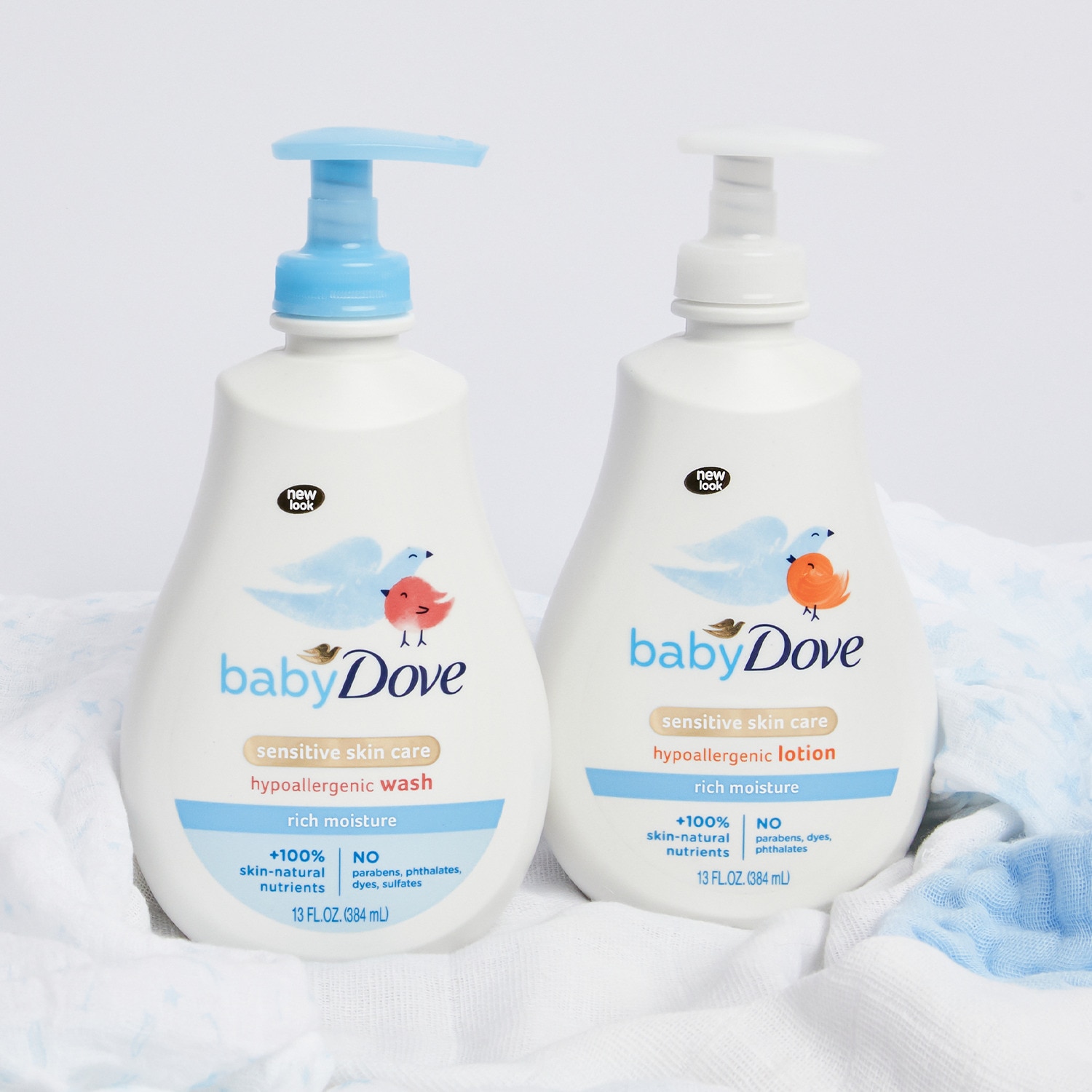 Image of two Baby Dove bathing product bottles in a bathroom