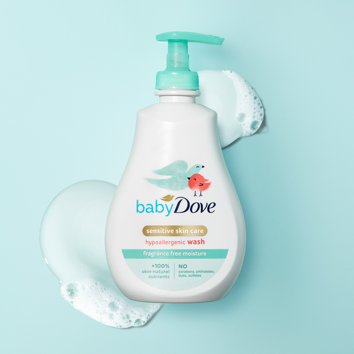 Image of a Baby Dove sensitive skin baby wash bottle laid on top of product texture
